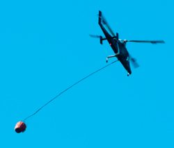 24 May 2015 A new chopper heading for
                            Lake Mendocino to get water. Maybe an Apache
                            AH64 modified for fire duty?