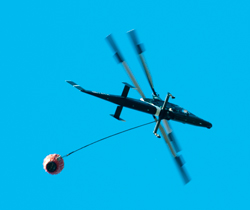 24 May 2015 A new chopper heading for
                            Lake Mendocino to get water. Maybe an Apache
                            AH64 modified for fire duty?