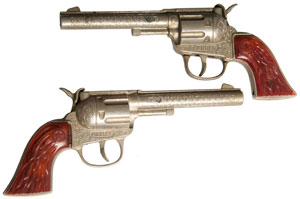 a pair of
                        Hubley Rodeo single shot cap pistols